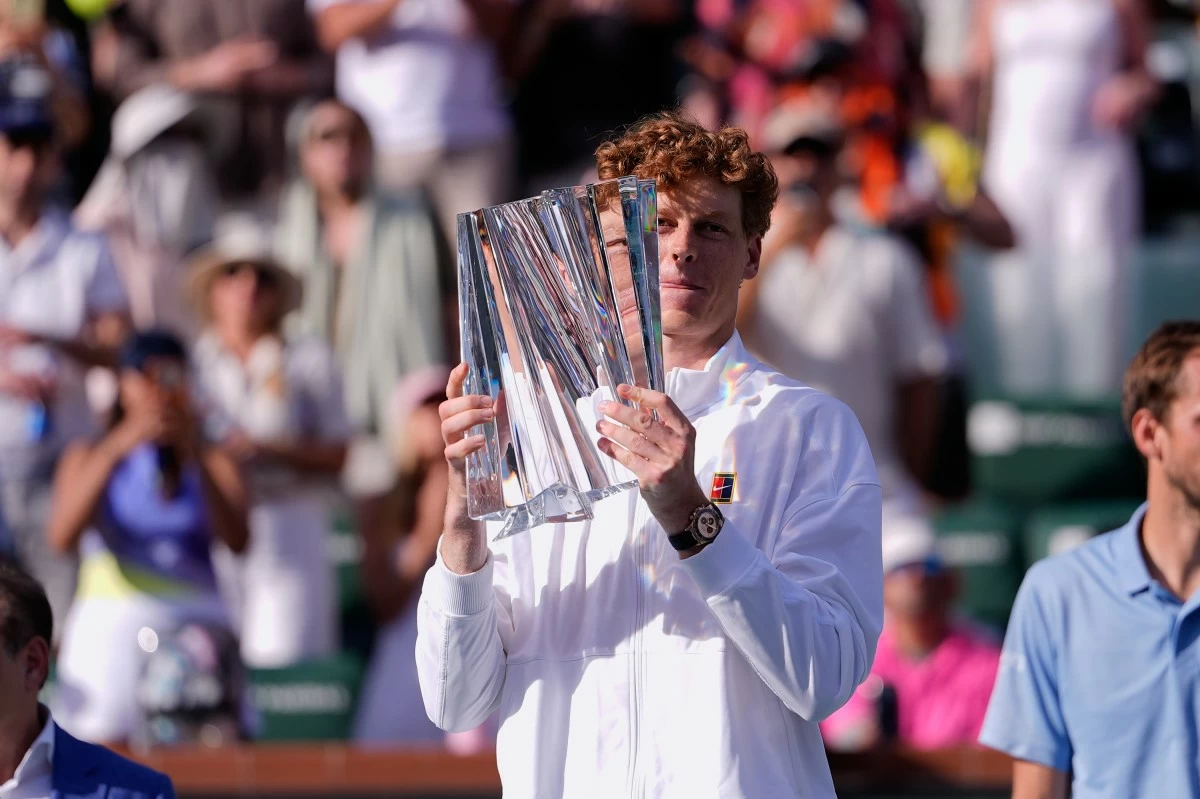 Jannik Sinner, of Italy, holds the winner's trophy after defeating Daniil Medvedev, of Russia, during a final match at the BNP Paribas Open tennis tournament, Sunday, March 15, 2026, in Indian Wells, Calif. (AP Photo/Mark J. Terrill)
