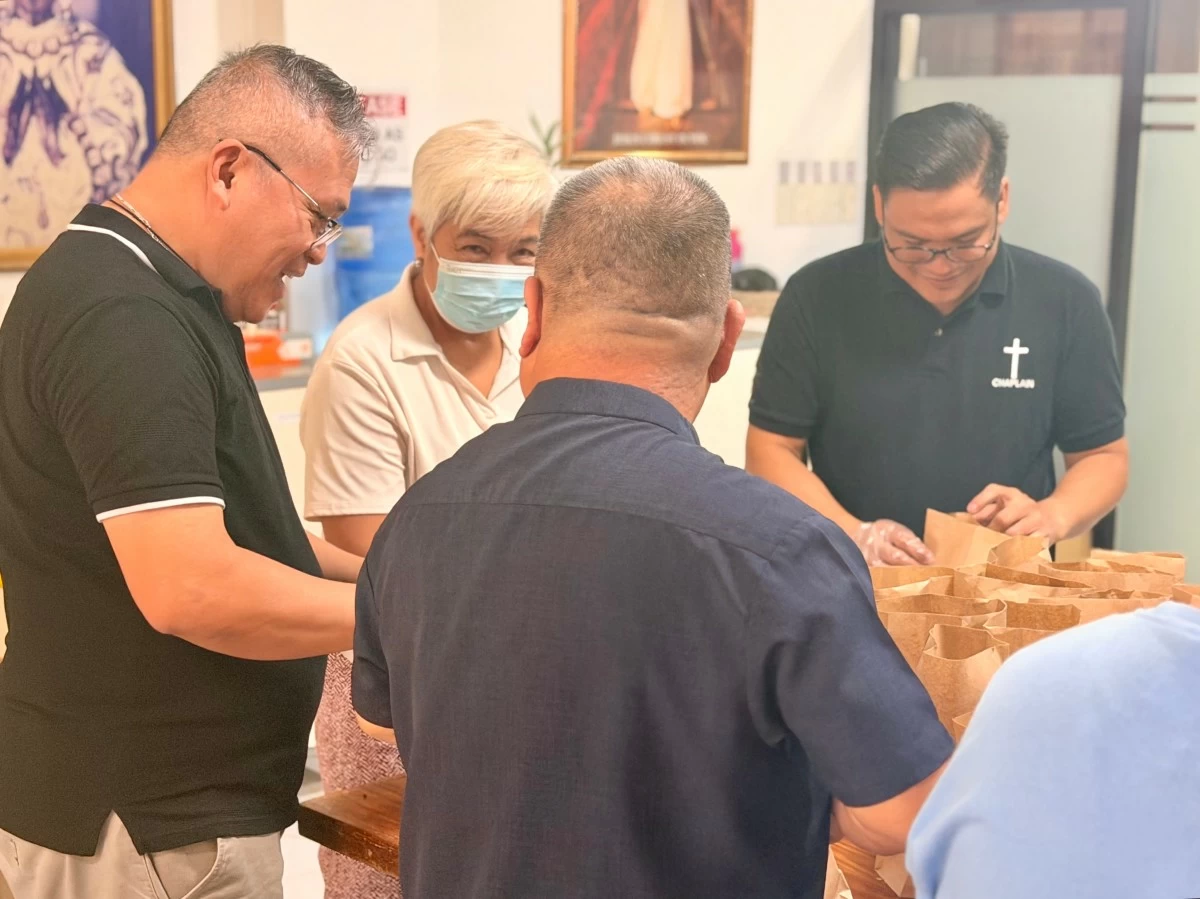 Bread and fillings are assembled by chaplaincy volunteers as part of the hospital’s daily feeding program.