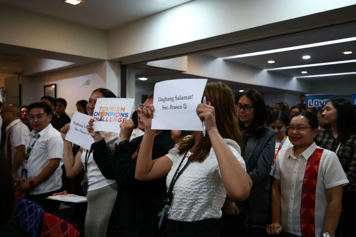Employees and officials of the Department of Tourism bid former Secretary Christina Garcia-Frasco a tearful farewell. (Photo courtesy of DOT)