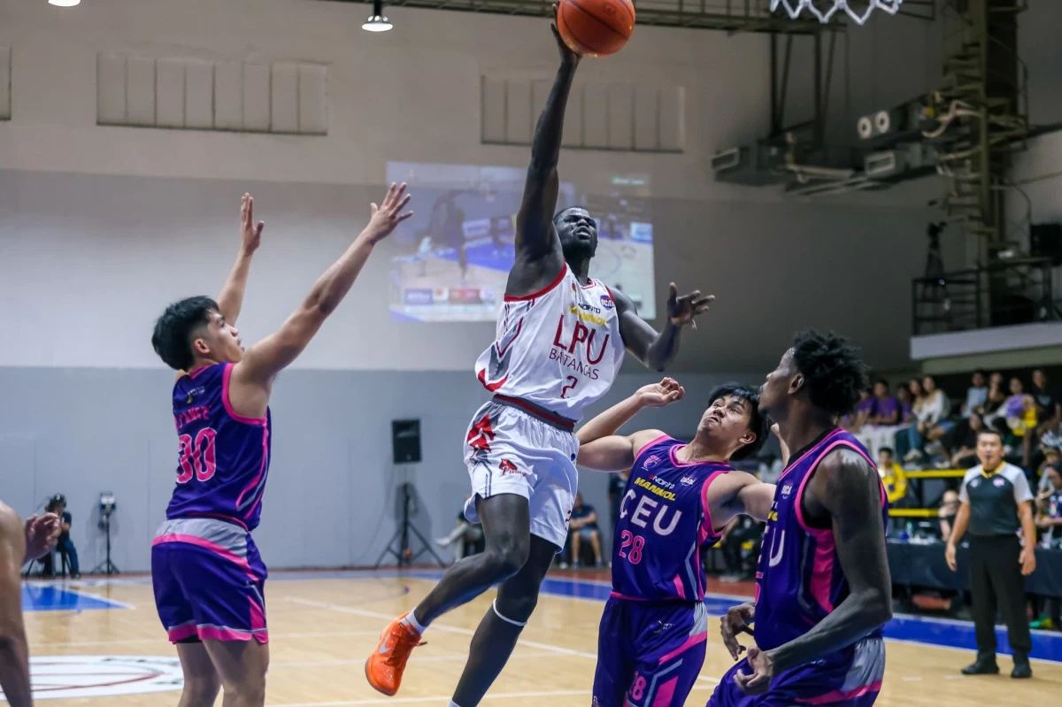 LPU-B'S Alpha Bah goes for the basket.