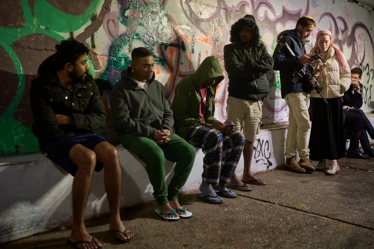 PEOPLE shelter in an underground tunnel as air raid sirens warn of incoming Iranian missiles in Jerusalem, Israel, Thursday, March 19, 2026. (AP)