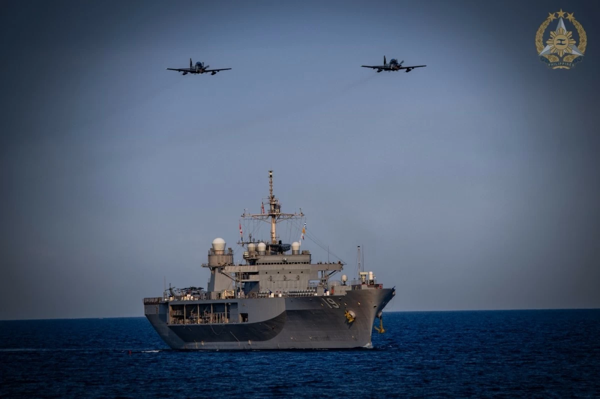 Two Philippine Air Force A-29B Super Tucano aircraft fly above USS Blue Ridge (LCC-19) during the bilateral Maritime Cooperative Activity 26-3.1 by the Armed Forces of the Philippines (AFP), Philippine Coast Guard (PCG), and United States Indo-Pacific Command (US Indopacom) in Manila Bay and waters off Mariveles, Bataan on March 20, 2026. (Photo by Edward Bungubung/PAOAFP)
