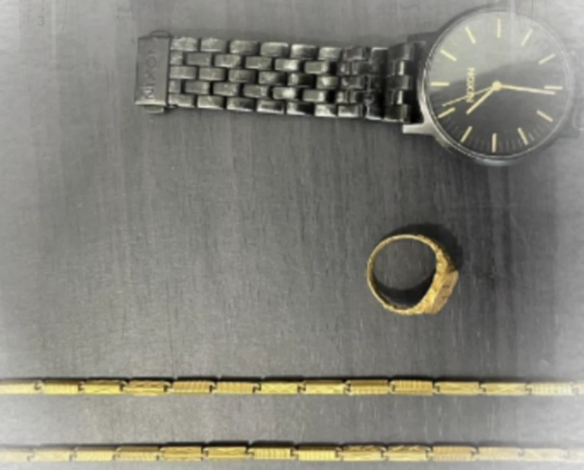 The victim's wristwatch and gold ring and necklace recovered from the robbery suspects (Photo from the Cavite PPO/MANILA BULLETIN) 