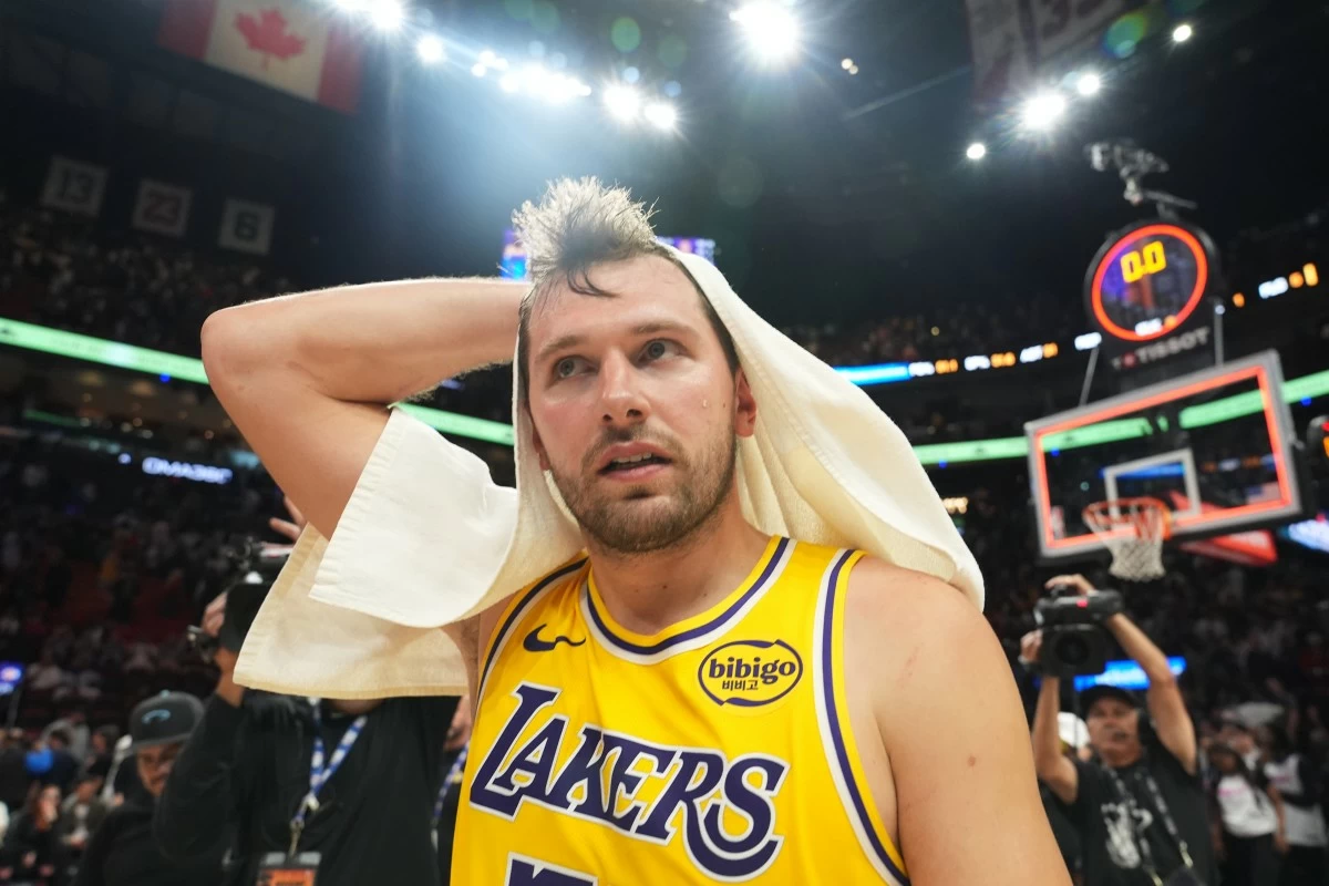 Los Angeles Lakers guard Luka Doncic walks off the court after the Lakers defeated the Miami Heat in an NBA basketball game, Thursday, March 19, 2026, in Miami. (AP Photo/Lynne Sladky)