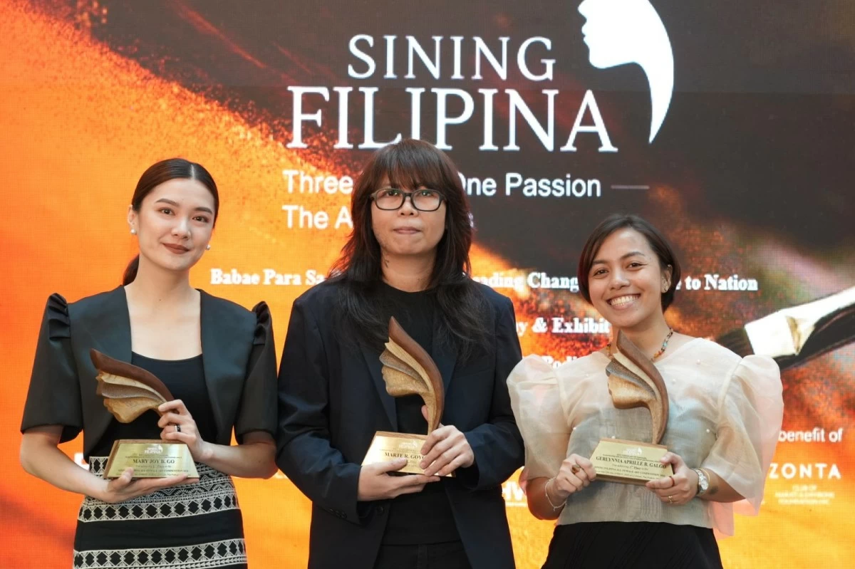 Second place winner Mary Joy B. Go, grand winner Marte R. Goyon, and third place winner Gerlynnia Aprille B. Galgo
