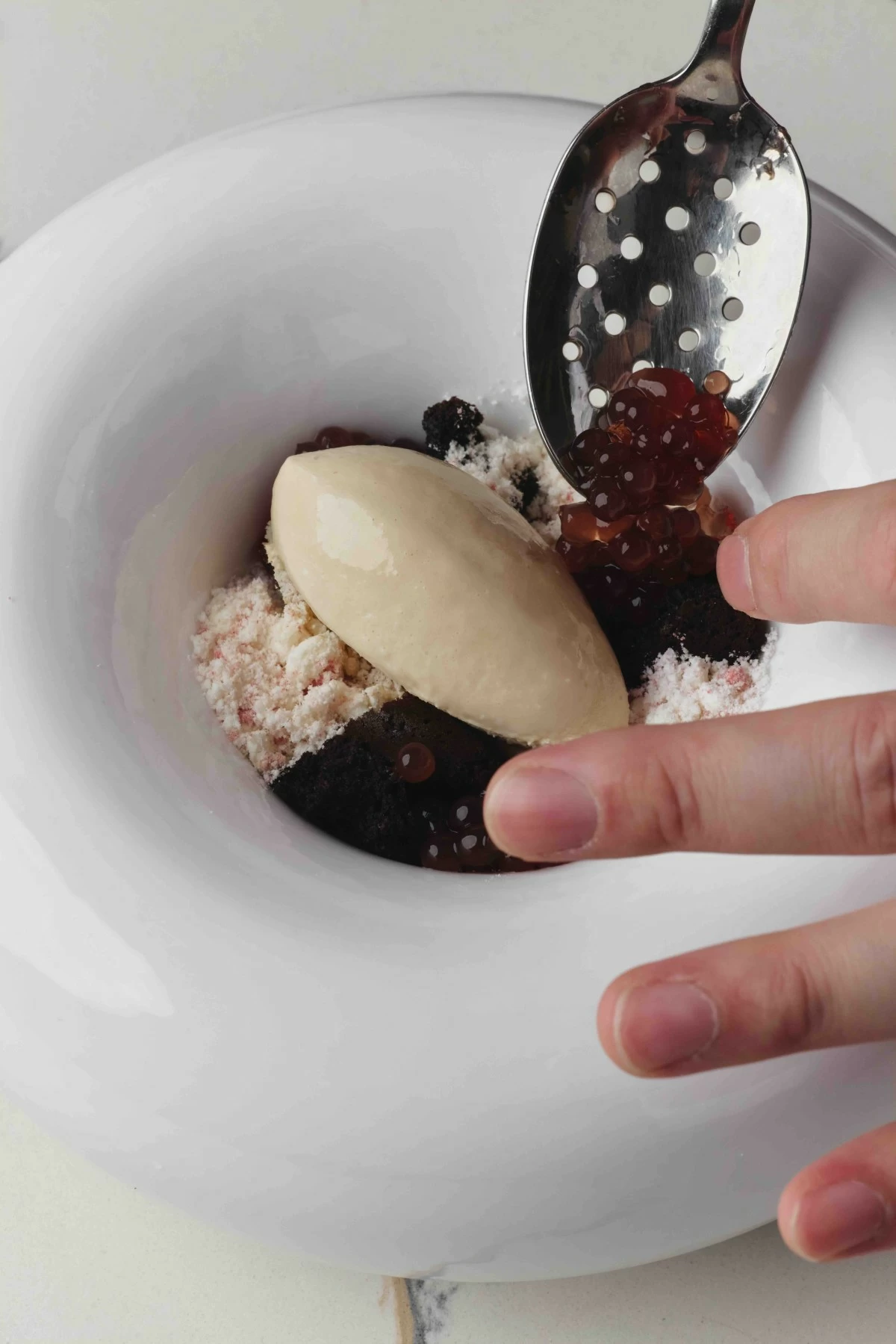 LUST DESSERT Spiced honey ice cream with strawberry, pomegranate, and chocolate in various textures, layered with crisp elements underneath