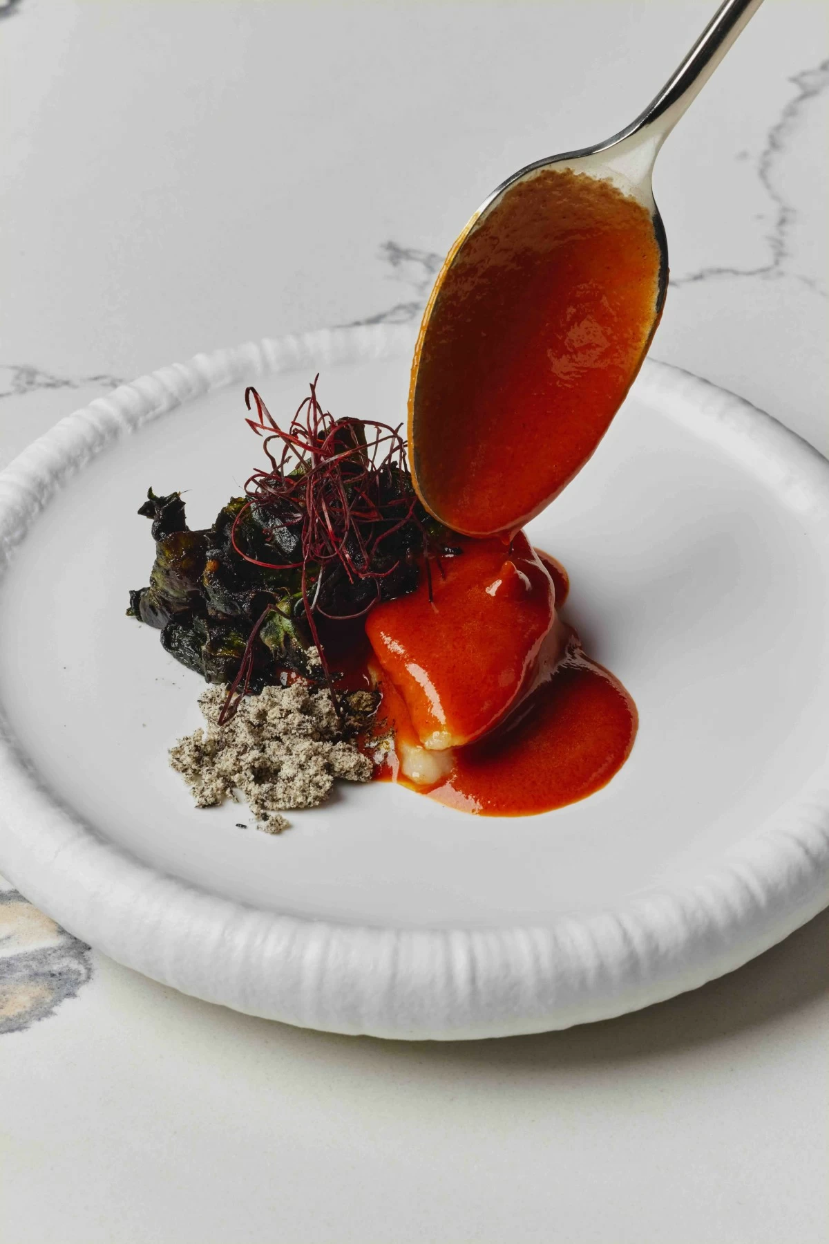 WRATH HEAT Monkfish in spiced red curry, with alugbati prepared charred, sautéed, and as ash, topped with chili threads