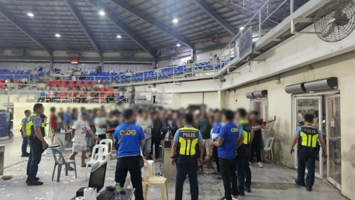 Police secure a coliseum in Tondo, Manila where an 24/7 operation of online sabong is allegedly being held. (photo: CIDG) 
