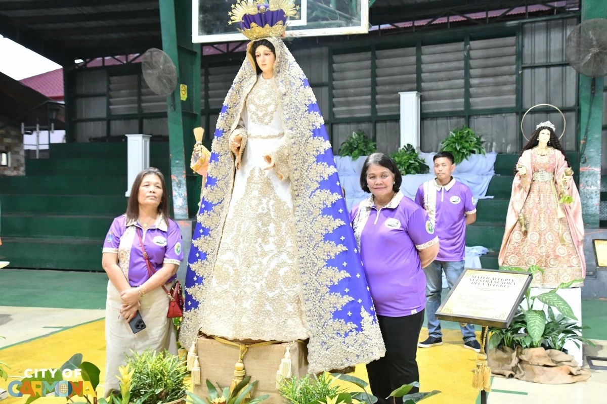 Mayor Dahlia A. Loyola with the saint under her family’s care, Nuestra Señora de la Alegria, during the blessing and inauguration of Cordero: 11th Lenten Exhibit in Carmona City on March 22 (Photo from Mayor Dahlia A. Loyola﻿'s Facebook page/MANILA BULLETIN)