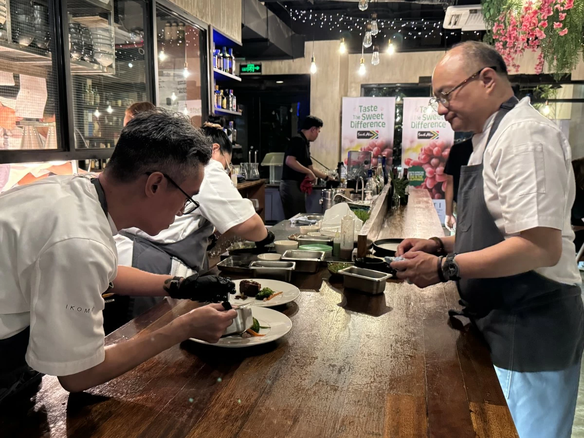Chef James Antolin preparing dishes infused with grapes, in honor of the occasion