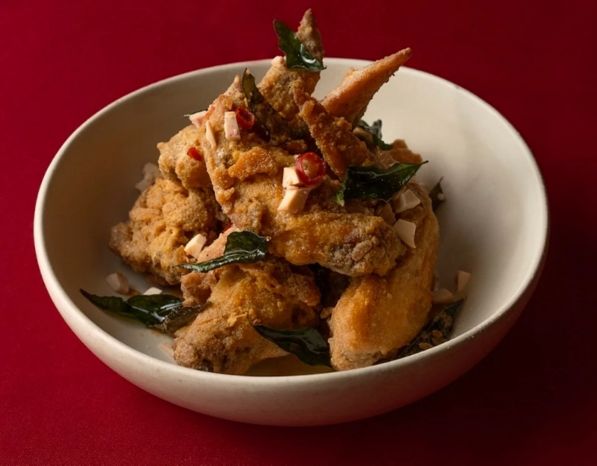 Salted egg chicken wings, finished with dalandan zest