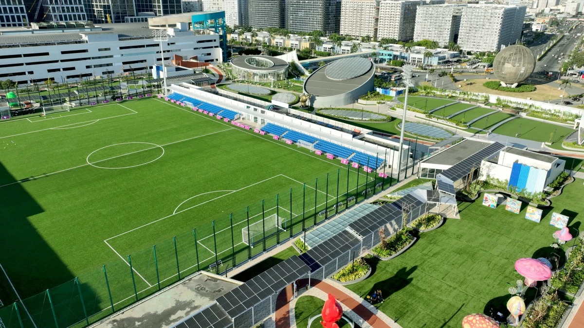 Solar panels have been seamlessly integrated into the walkway that wraps around SM Mall of Asia's MOA Sky.