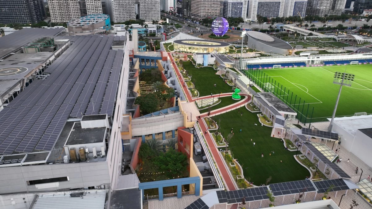 Solar panels have been seamlessly integrated into the walkway that wraps around SM Mall of Asia's MOA Sky.