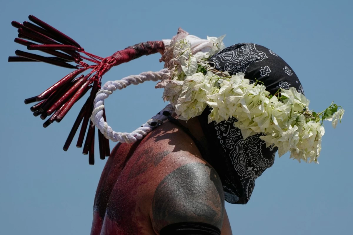 A flagellant prays during Good Friday rituals in Barangay San Pedro Cutud, San Fernando City, Pampanga. (AP)