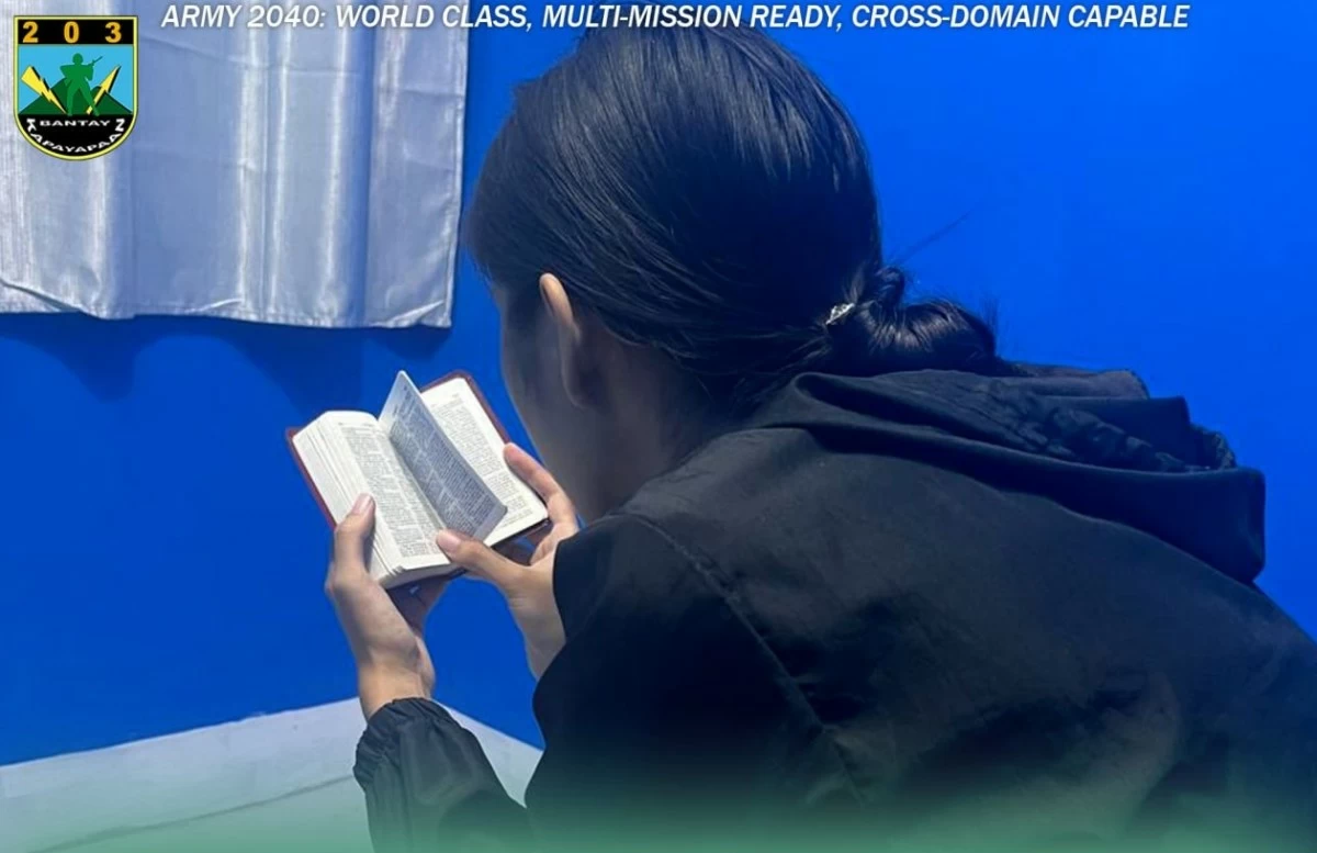 Charlize Cameron Garzon reads a Bible during a spiritual enlightenment session. (Photo: 203rdIB)