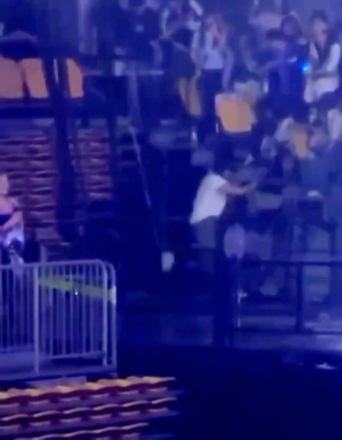 Super Junior's Ryeowook and fans falling after the fence collapsed (Screenshot from justelfsj video on X)