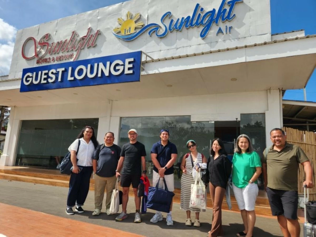 The author (in white) together with other media practitioners at the Sunlight Air lounge (Photo courtesy of Sunlight Air)