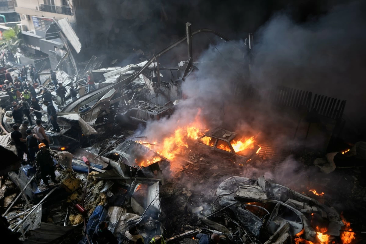 First responders work at the site of an Israeli airstrike that struck an apartment building in Beirut, Lebanon, Wednesday, April 8, 2026. (AP Photo/Bilal Hussein)