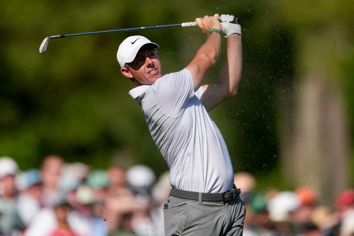 Rory McIlroy, of Northern Ireland, watches his tee shot on the 12th hole during the second round of the Masters golf tournament at the Augusta National Golf Club, Friday, April 10, 2026, in Augusta, Ga. (AP Photo/Eric Gay)