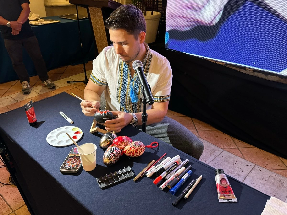 Arthur Tselishchev guides attendees through the vibrant world of Petrykivka painting. (Photo from The Manila Hotel)
