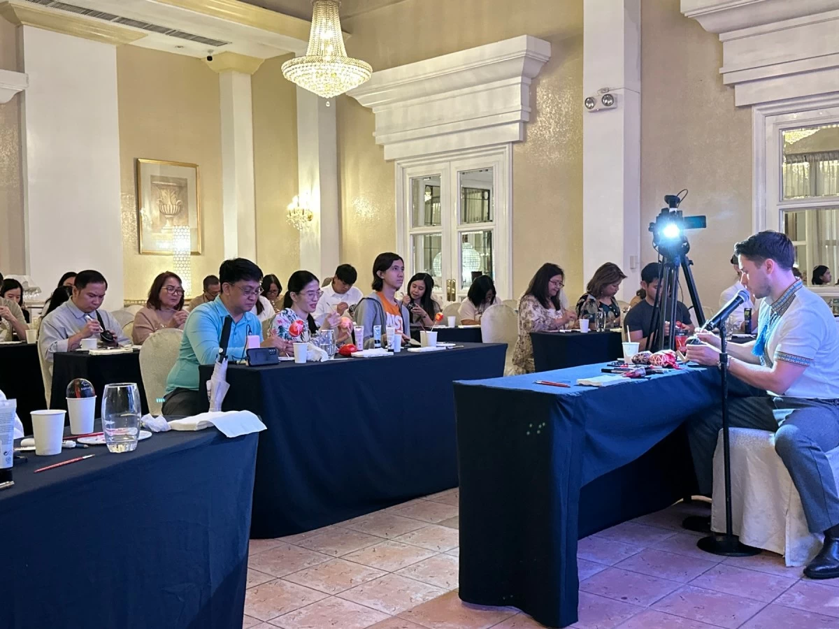 Attendees learn the delicate art and symbolism of Pysanka eggs. (Photo from The Manila Hotel)