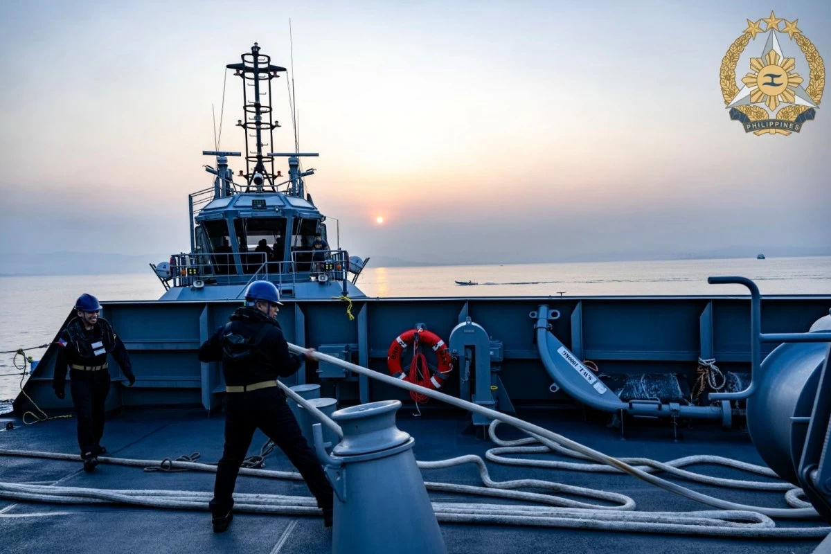 BRP Rajah Sulayman (PS20), accompanied by a Naval Tug Boat, detaches from the Naval Operating Base (NOB) and proceeds to the designated rendezvous point in preparation for its participation in the Multilateral Maritime Cooperative Activity (MMCA) on April 11, 2026. (Photo: Armed Forces of the Philippines)
