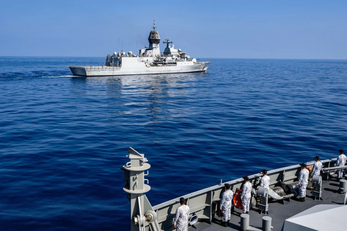 Philippine Navy personnel engage with Australian counterparts during a replenishment-at-sea (RAS) exercise, fostering camaraderie and enhancing interoperability among participating forces, as part of the Multilateral Maritime Cooperative Activity (MMCA). (Photo: Armed Forces of the Philippines)
