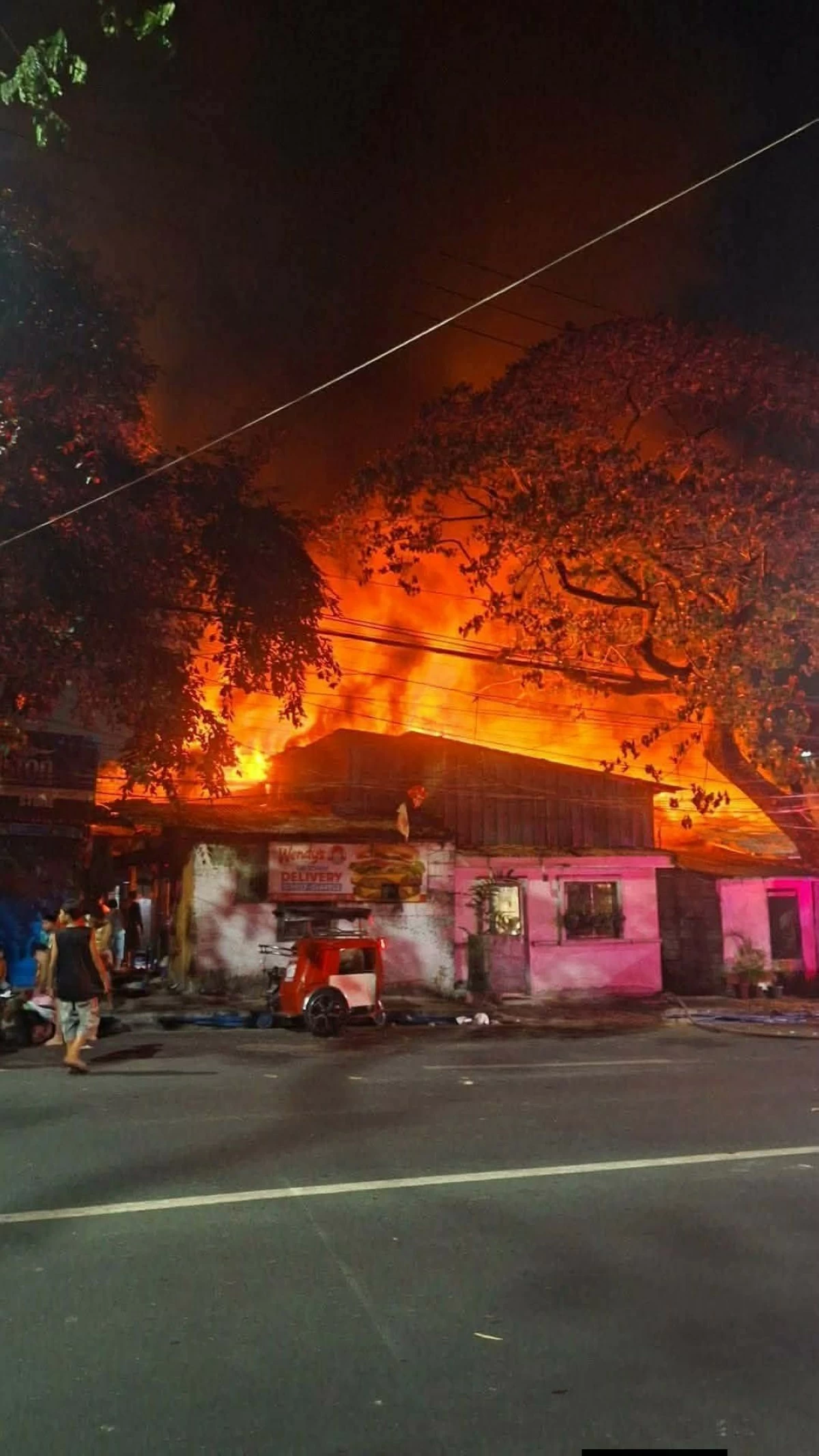 Blaze engulfs a residential area along C.P. Garcia Avenue in Barangay U.P. Campus, Quezon City on Monday night, April 13. (Photo courtesy of Philippine Emergency Alerts)