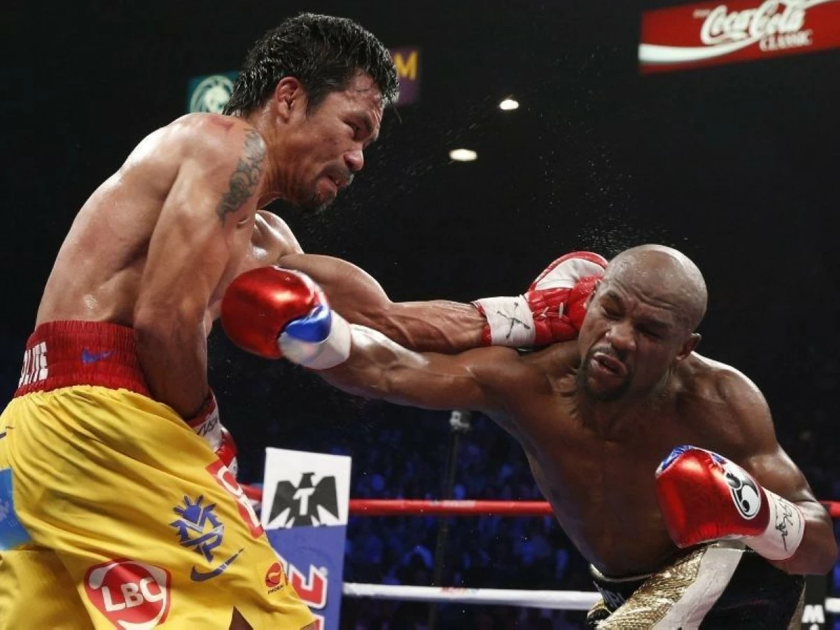 Manny Pacquiao (left) during his first fight against Floyd Mayweather Jr. (File photo)