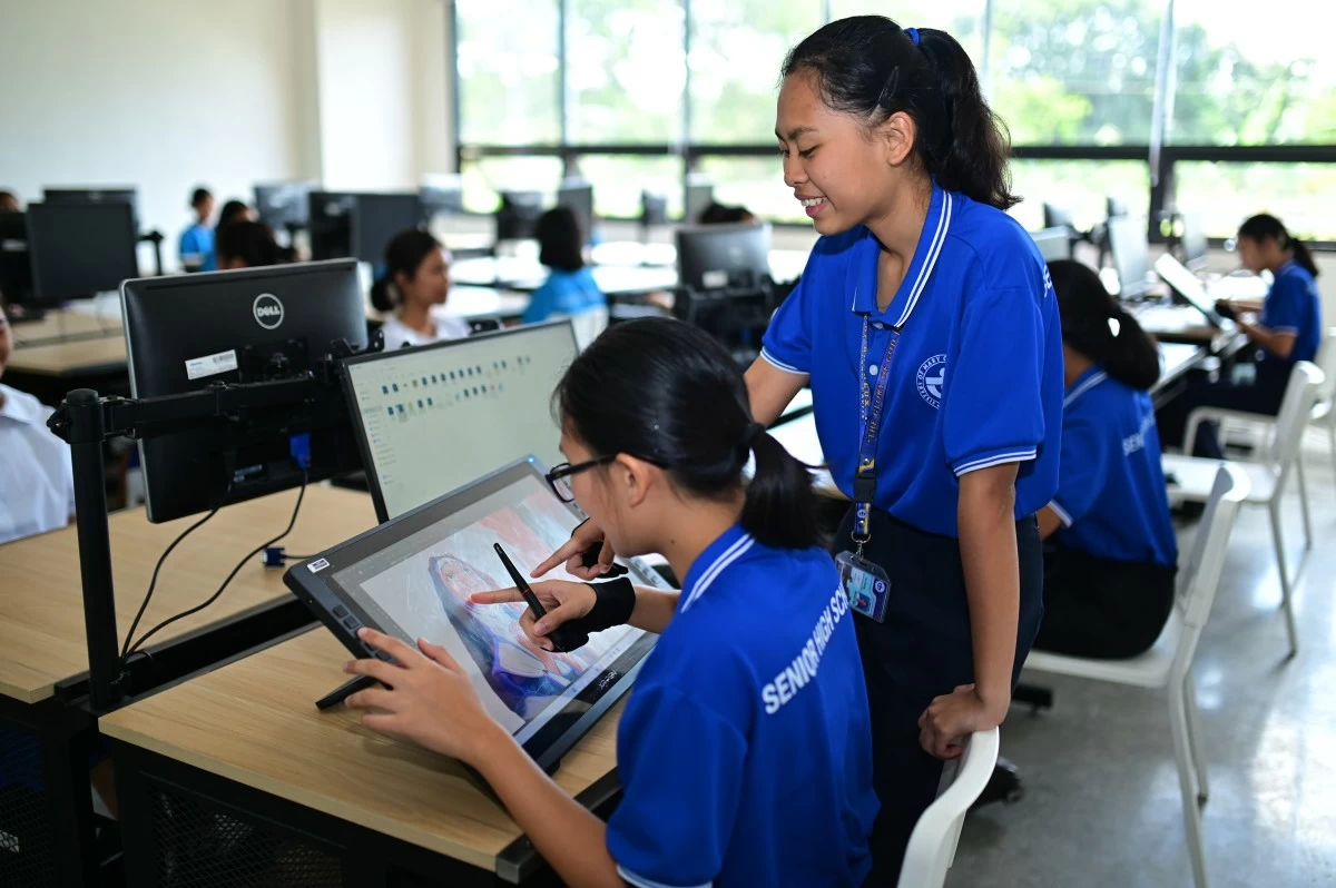 Students at the Sisters of Mary School use digital design tools inside the Felicidad T. Sy Hall Digital Transformation Center, where modern workstations support technology-driven learning and creative skill development.