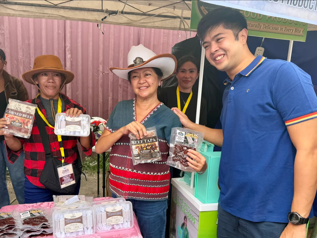 The First Lady and Vinny Marcos tour the exhibition booths during the 30th Rodeo Masbateño Festival. Mrs. Marcos took a close interest in the local crafts, asking vendors about their materials and earmarking several items to be featured in an upcoming exhibition for the ASEAN summit.