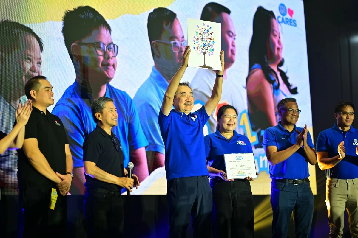 
Members of the Down syndrome community present a token of appreciation to Mr. Hans Sy, symbolizing partnership and support for inclusive communities
