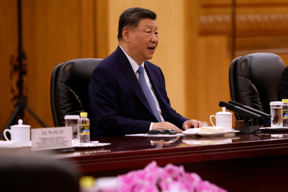China's President Xi Jinping attends a meeting with Spain's Prime Minister Pedro Sanchez, third right, at the Great Hall of the People in Beijing Tuesday, April 14, 2026. (Haruna Furuhashi/Pool Photo via AP)
