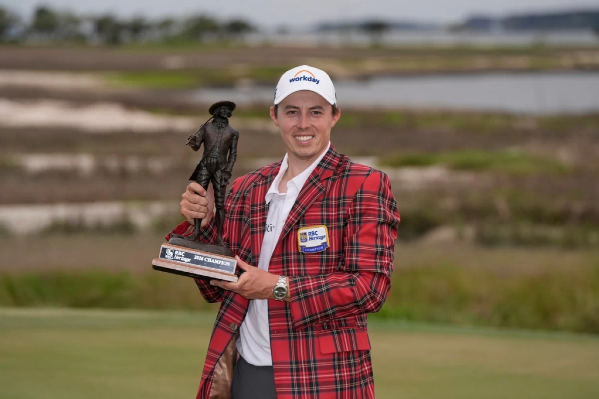Matt Fitzpatrick, of England, poses with the trophy after winning the RBC Heritage golf tournament Sunday, April 19, 2026, in Hilton Head, S.C. (AP Photo/Mike Stewart)