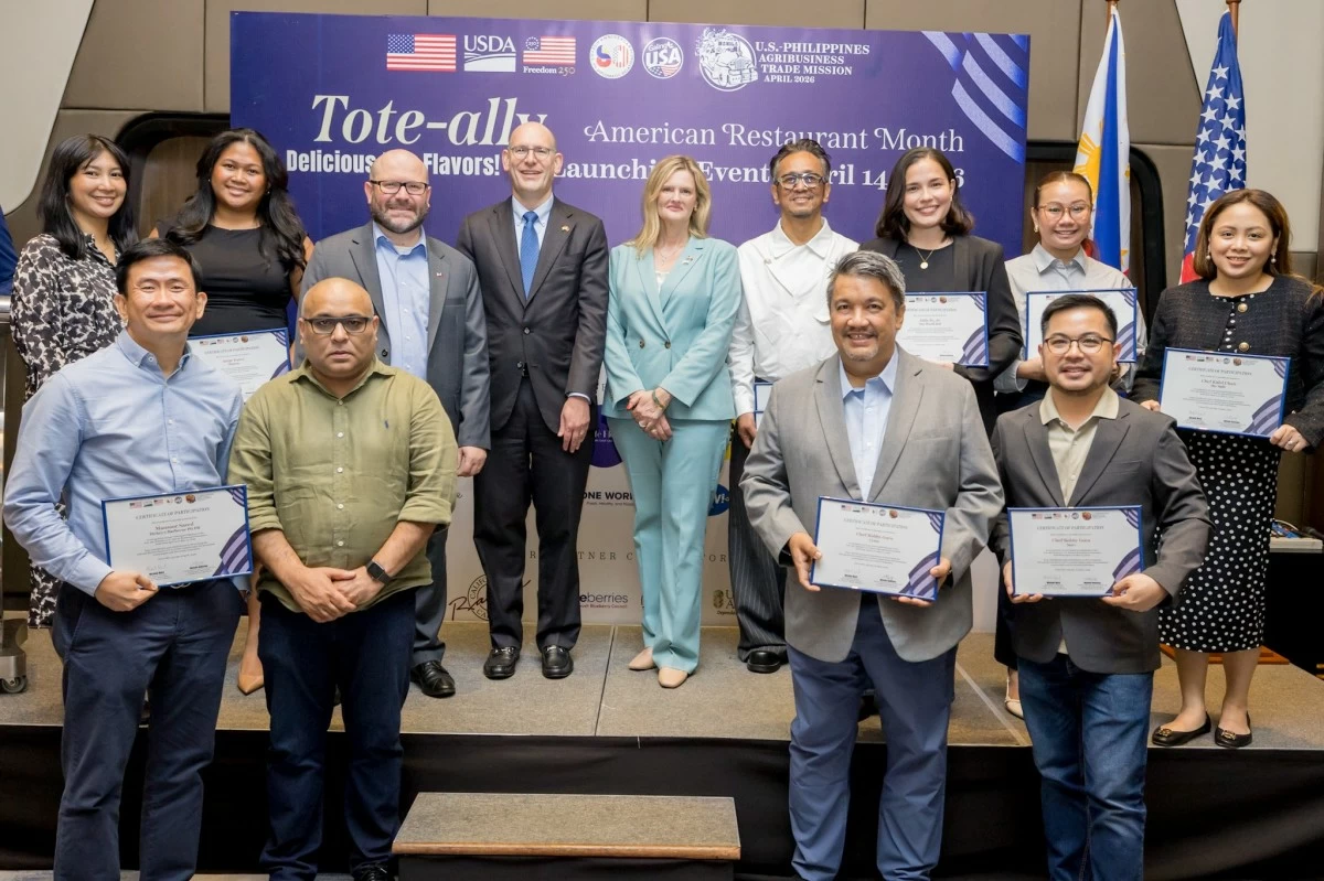 US Department of Agriculture Under Secretary Michelle Bekkering (center), Chargé d'Affaires, a.i., Y. Robert Ewing (fourth from left), and Agricultural Counselor Michael Ward (third from left) join partner restaurant representatives at the American Restaurant Month launch on April 14 in Manila. 