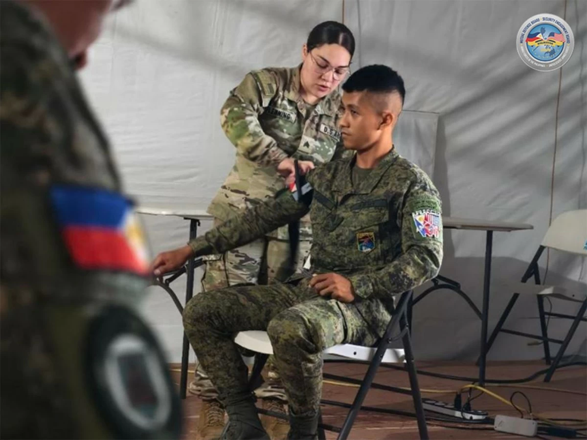 Armed Forces of the Philippines (AFP) and United States Armed Forces personnel actively treat simulated casualties and execute critical care interventions during the Tactical Combat Casualty Care (TCCC) training on April 20, 2026 at Daniel Z. Romualdez Airport in Tacloban City, Leyte as part of Exercise Balikatan. (Photo: AFP)