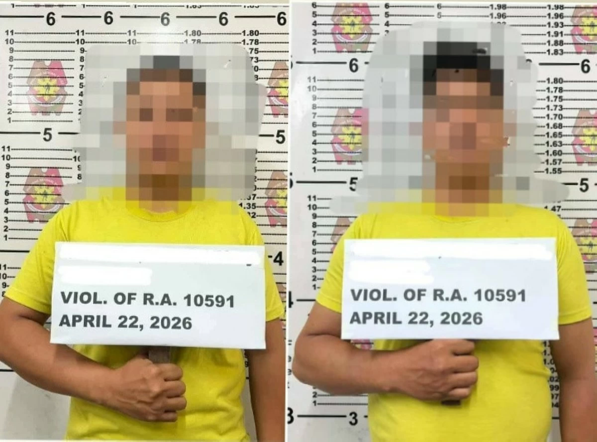 Two security guards with blurred faces are presented following their arrest during a condominium inspection in Barangay Lingunan, Valenzuela City on April 22, 2026, over alleged possession of unlicensed firearms and security violations. (Photo courtesy of VCPS)