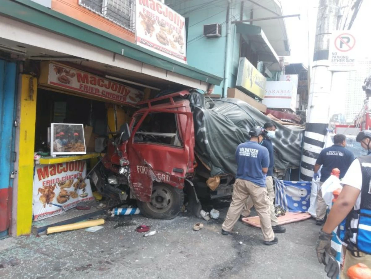 A truck smashed into a chicken store in Marikina City on April 25, leaving two people dead, including a nine-year-old boy, and injuring six others. (Photos from Marikina CPS)