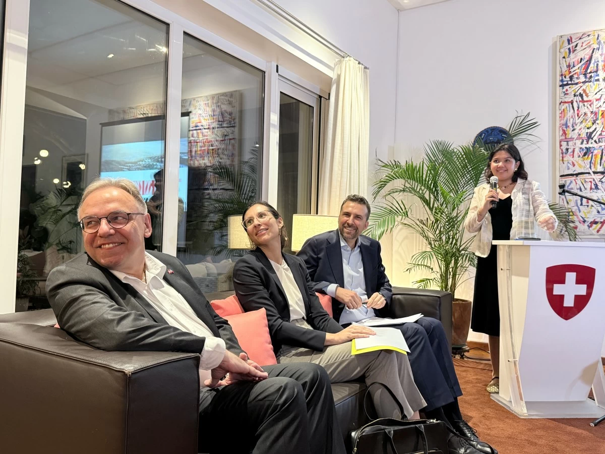 The Swiss Embassy team shares a light moment during a gathering for the media at the Swiss Ambassador’s residence.