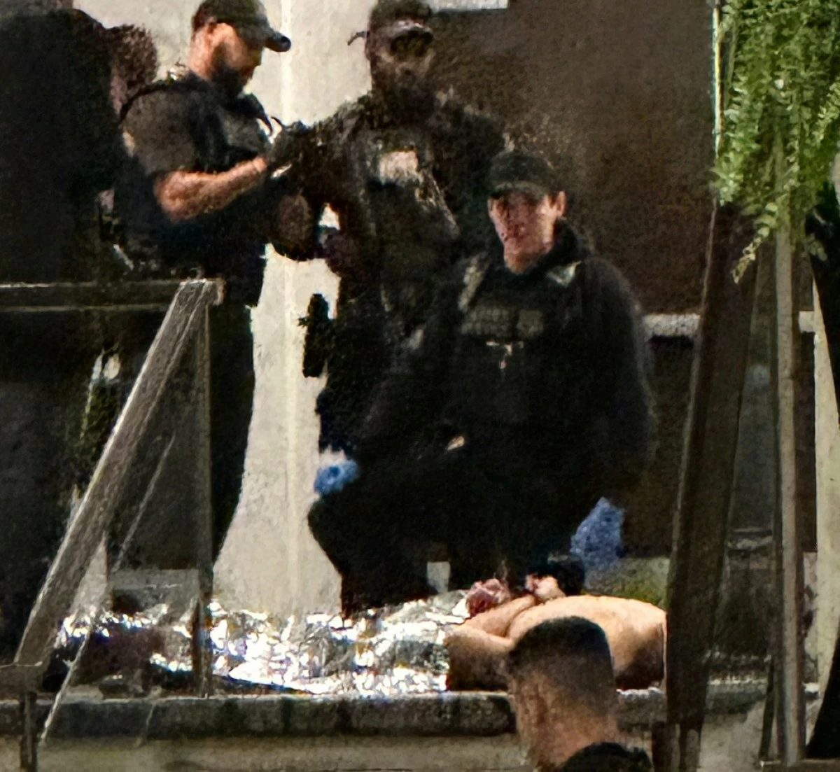 Members of law enforcement control shooting suspect Cole Tomas Allen during the White House Correspondents Dinner, Saturday, April 25, 2026, in Washington. (AP Photo/Alex Brandon) 