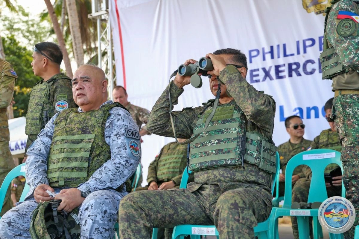 General Romeo S. Brawner Jr. (right), AFP Chief of Staff, and Vice Admiral Alan M. Javier, commander of Western Command, monitor the impact of synchronized air and land strikes during the Counter-Landing Live Fire Exercise (CLLFX-West) held on April 27, 2026 at Apurawan Beach Landing Site in Aborlan, Palawan during Exercise Balikatan. (Photo by SSg Ambay PA/PAOAFP)