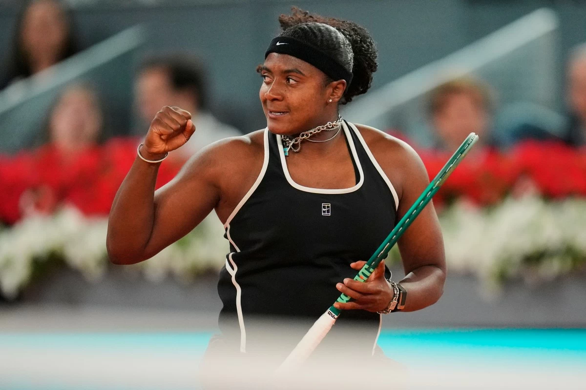 Hailey Baptiste, of the United States, celebrates a point during her match against Aryna Sabalenka, of Belarus, at the Madrid Open tennis tournament in Madrid, Tuesday, April 28, 2026. (AP Photo/Manu Fernandez)