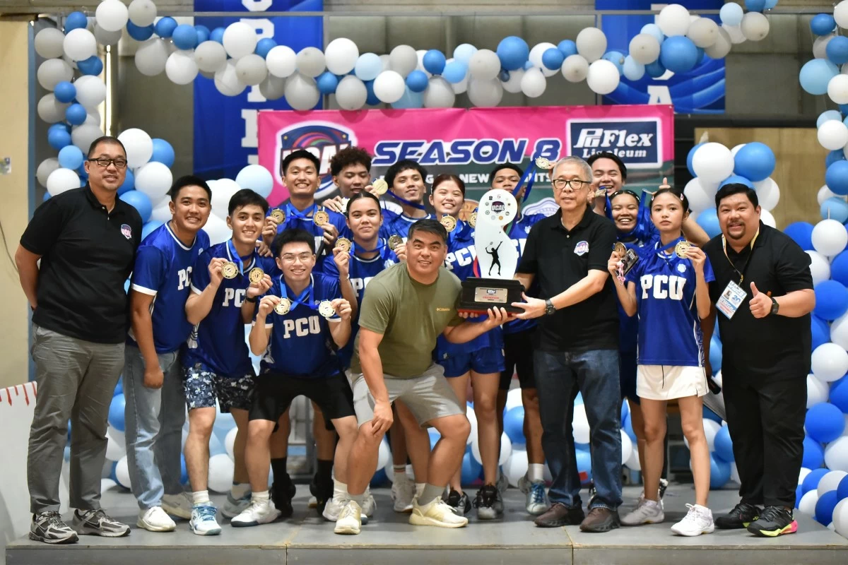 UCAL Chairman Horacio Lim (right) hands the championship trophy to PCU-D ManCom representative Johnny Belandrez after the Dolphins dominated the badminton tournament. Also shown are PCU players and UCAL Chief Finance Officer Bernard Yang. (UCAL)