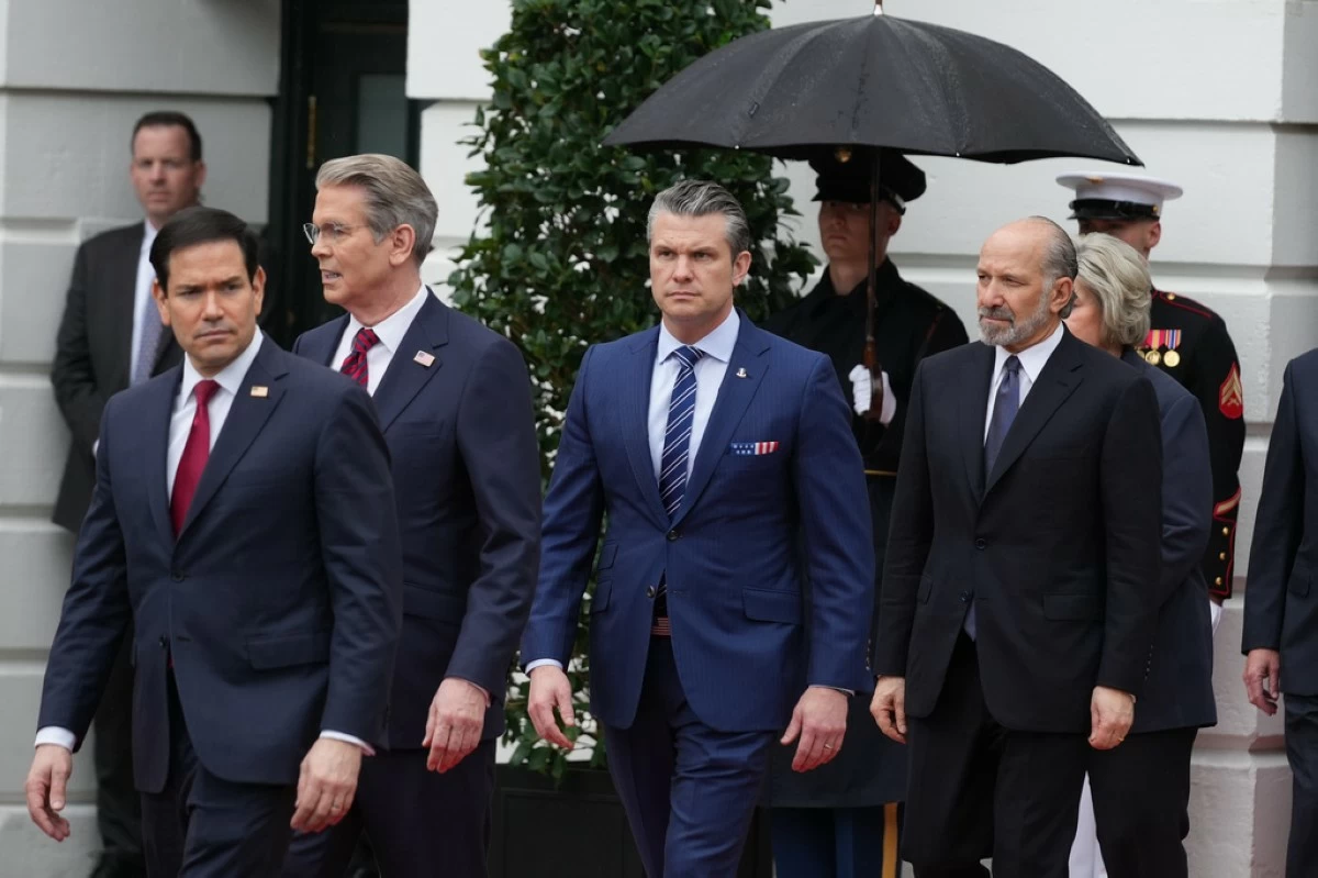 From left, Secretary of State, Marco Rubio, Treasury Secretary Scott Bessent, Secretary of Defense Pete Hegseth and Commerce Secretary Howard Lutnick, arrive before President Donald Trump and first lady Melania Trump greet Britain's King Charles III and Queen Camilla during a State Visit arrival ceremony on the South Lawn of the White House, Tuesday, April 28, 2026, in Washington. (AP Photo/Mark Schiefelbein)