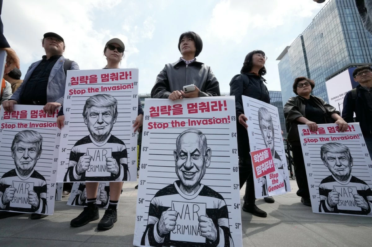 South Korean protesters hold banners depicting U.S. President Donald Trump and Israeli Prime Minister Benjamin Netanyahu during a rally denouncing the U.S. and Israel's attack on Iran, near the U.S. Embassy in Seoul, South Korea, Wednesday, April 29, 2026. (AP Photo/Ahn Young-joon)