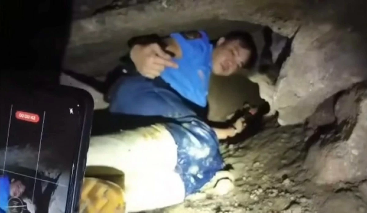 Police personnel inspect and enter an underground tunnel beneath a pawnshop in Barangay Nova Proper, Novaliches, Quezon City after authorities foiled an attempted robbery. (Photo courtesy of Novaliches 