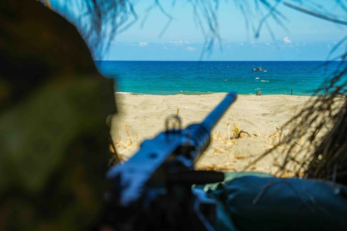 Philippine Army trooper in battle position with his 50mm caliber machine gun engages a simulated maritime threat with sustained direct fire during the Counter-Landing Live Fire Exercise North (CLLFX-North) as part of Exercise Balikatan 41-2026 on May 4 at La Paz Sand Dunes, Laoag, Ilocos Norte. (Photo: Armed Forces of the Philippines)
