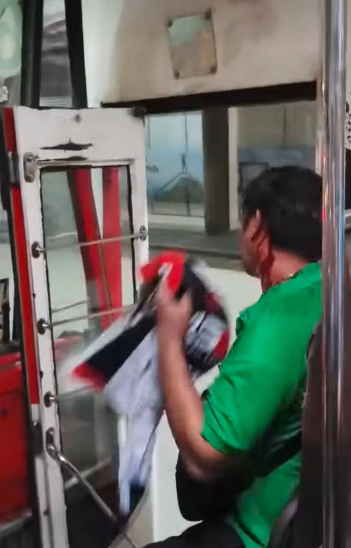 In photo: The bus conductor was injured after being attacked by the suspects during a road rage incident in Quezon City (Screengrab from a video taken by a passenger)