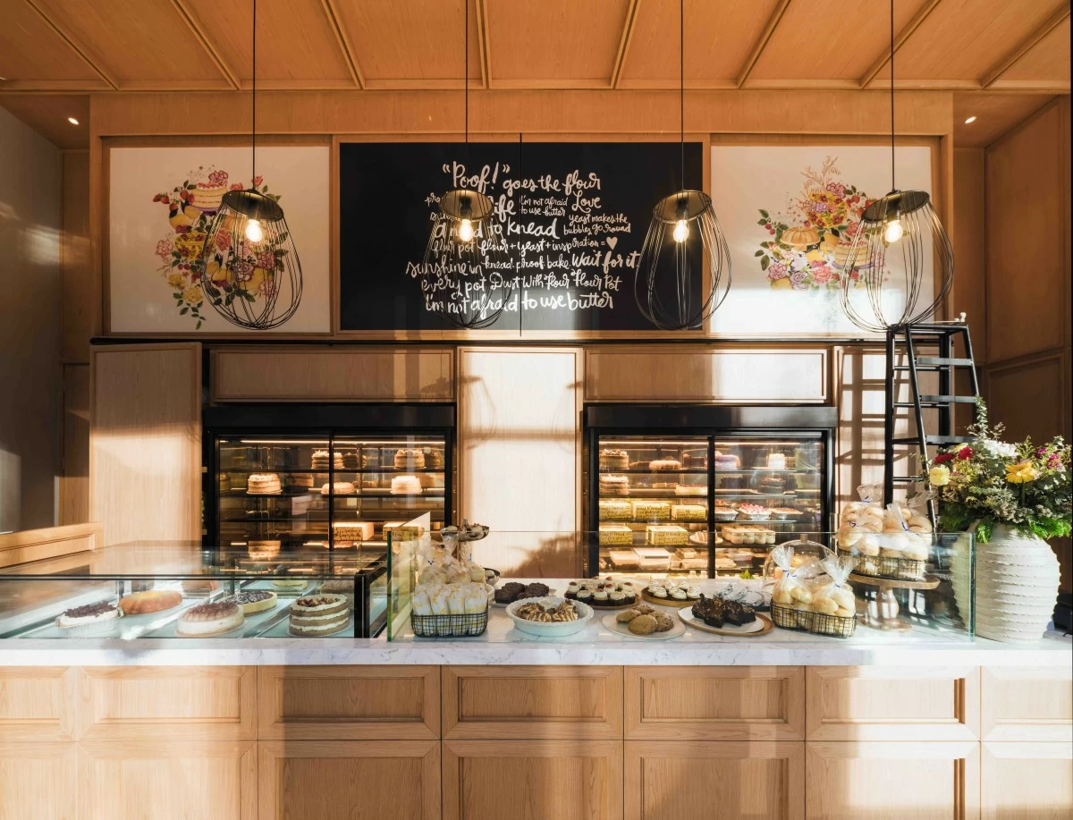 SWEET COUNTER The bakery display presents Flour Pot’s selection of cakes and pastries, including its signature butter rum cake and fruit-forward creations made with local ingredients. (Photo: Jay Jallorina)