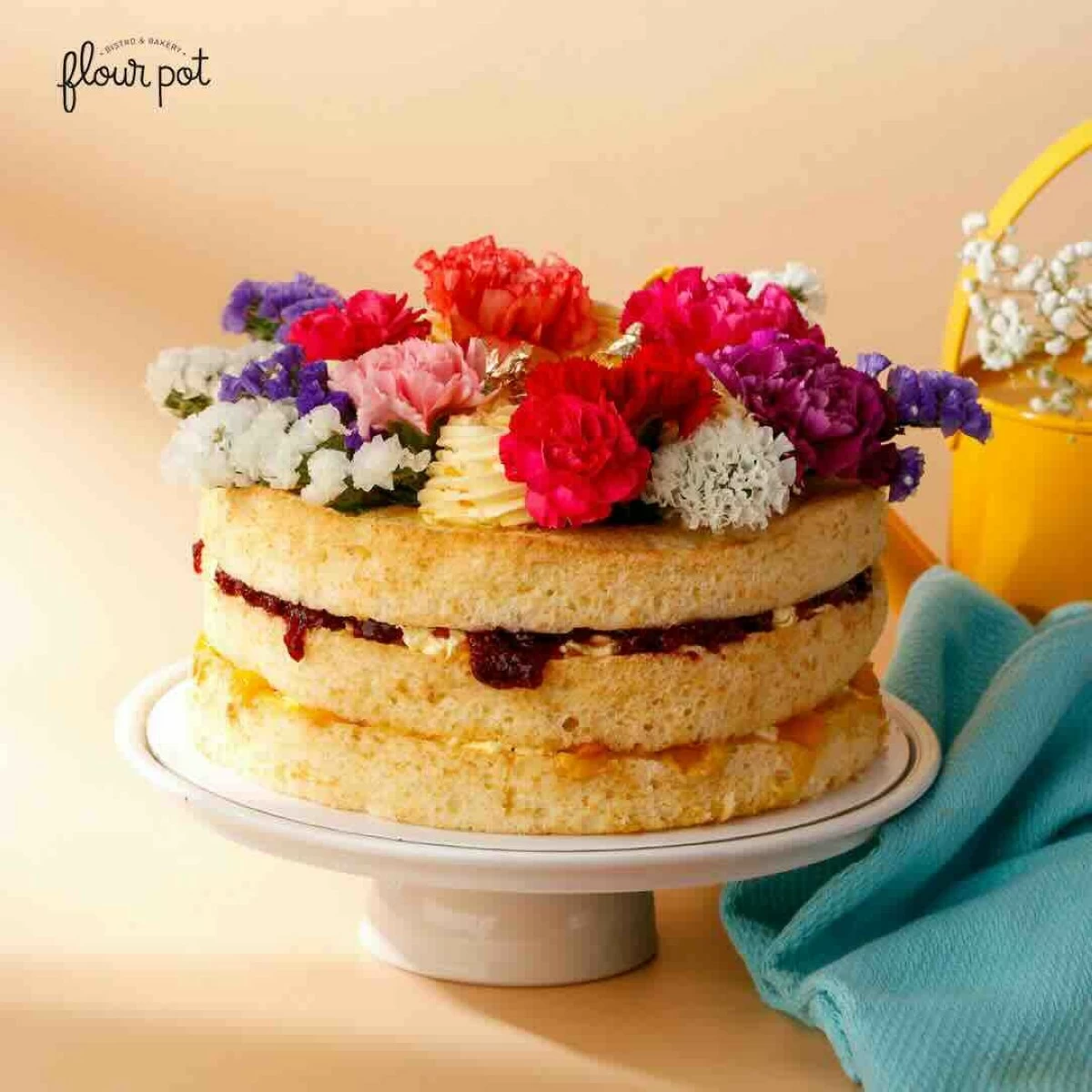 EMELIE CAKE The Emelie cake layers vanilla sponge with mango buttercream and jam made from foraged sampinit, or wild raspberries. (Photo: Flour Pot Bistro and Bakery)